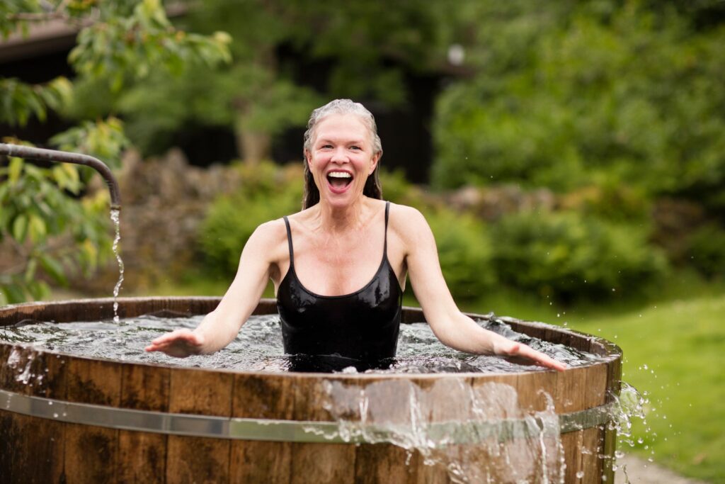 A woman from Kalamazoo cold plunging in winter weather.